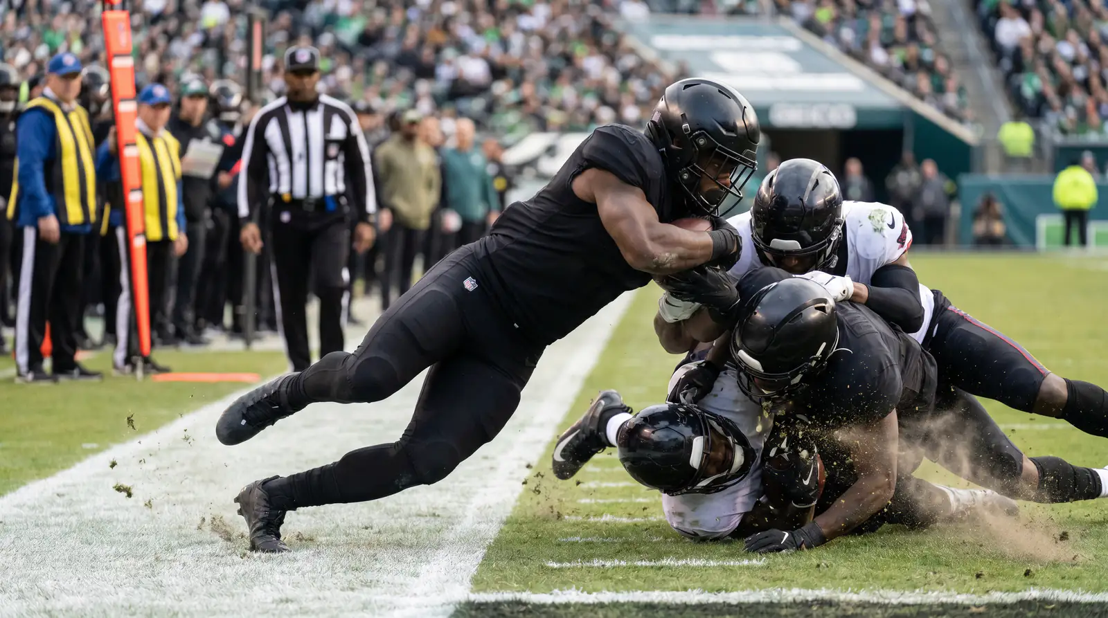 Short-yardage running back plunging into the line at the goal line